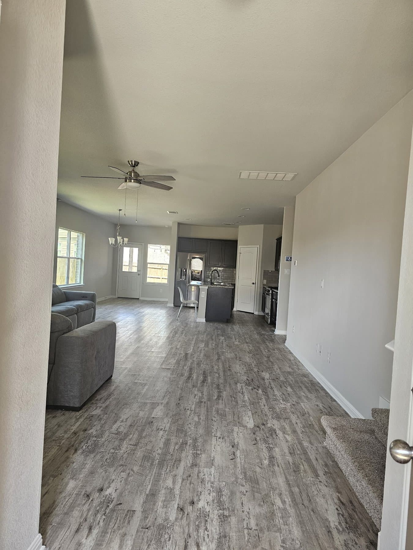 Freshly painted open plan living room and kitchen in a two-storey Greater Austin home