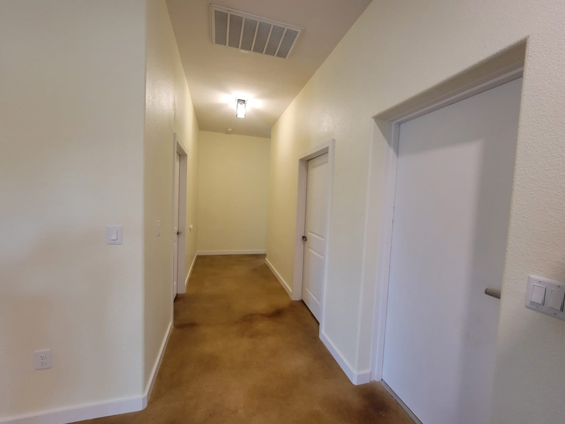 Painted corridor with fresh white walls and doorways