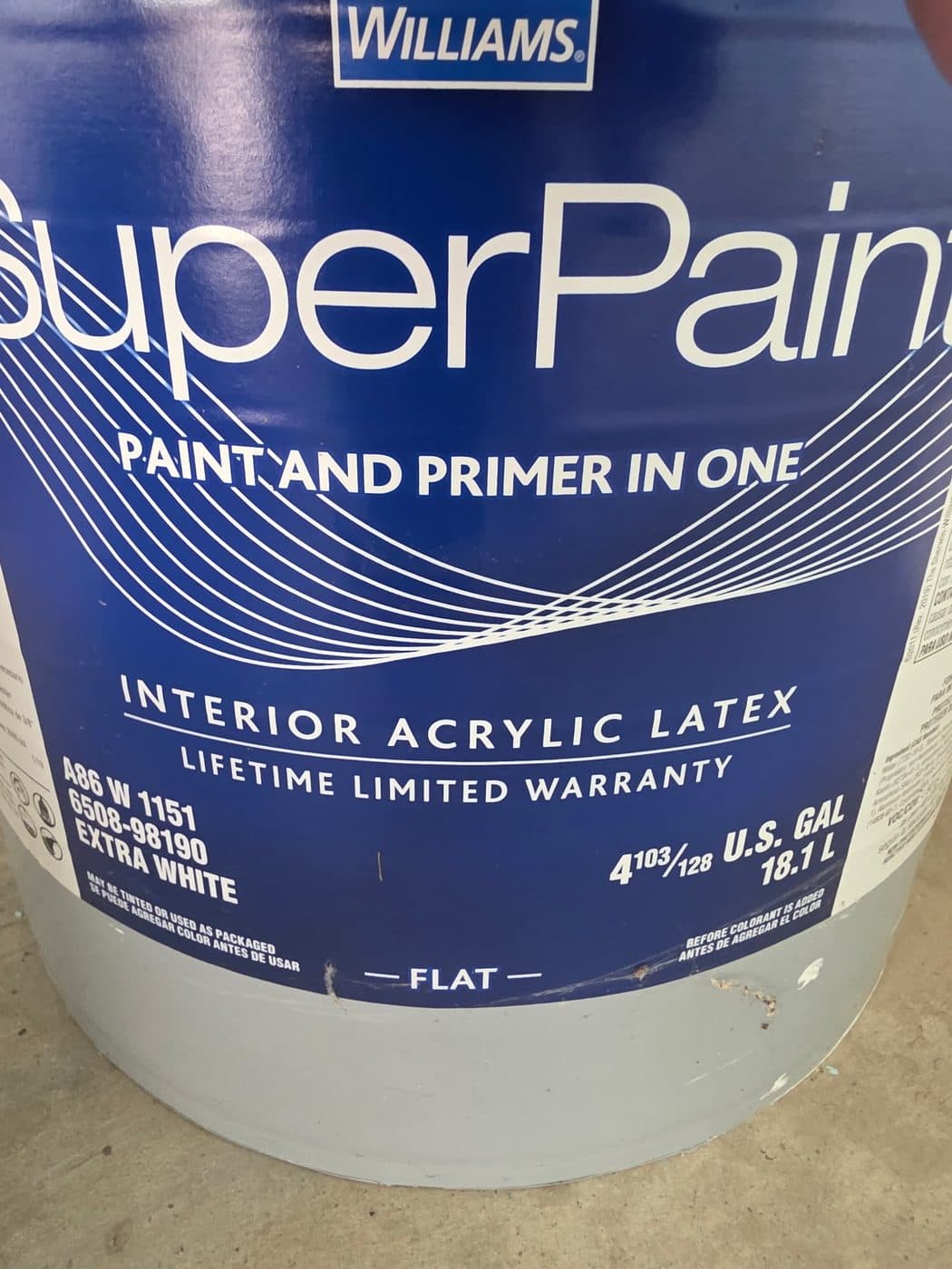 Five gallon bucket of Sherwin-Williams SuperPaint interior acrylic latex on a job site