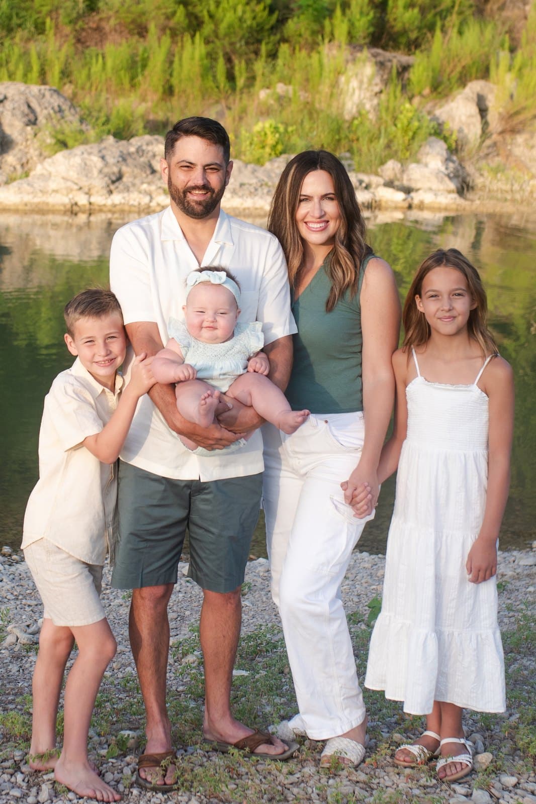 Dustin and Kristin Allan with their three children, by the water in the Texas Hill Country